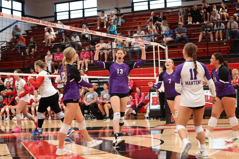 Manteno's Olivia McElroy, center, celebrates a point against Bradley-Bourbonnais during the Panthers' victory in three sets, 25-21, 23-25, 25-17, over the Boilermakers on Monday, Sept. 15, 2025.