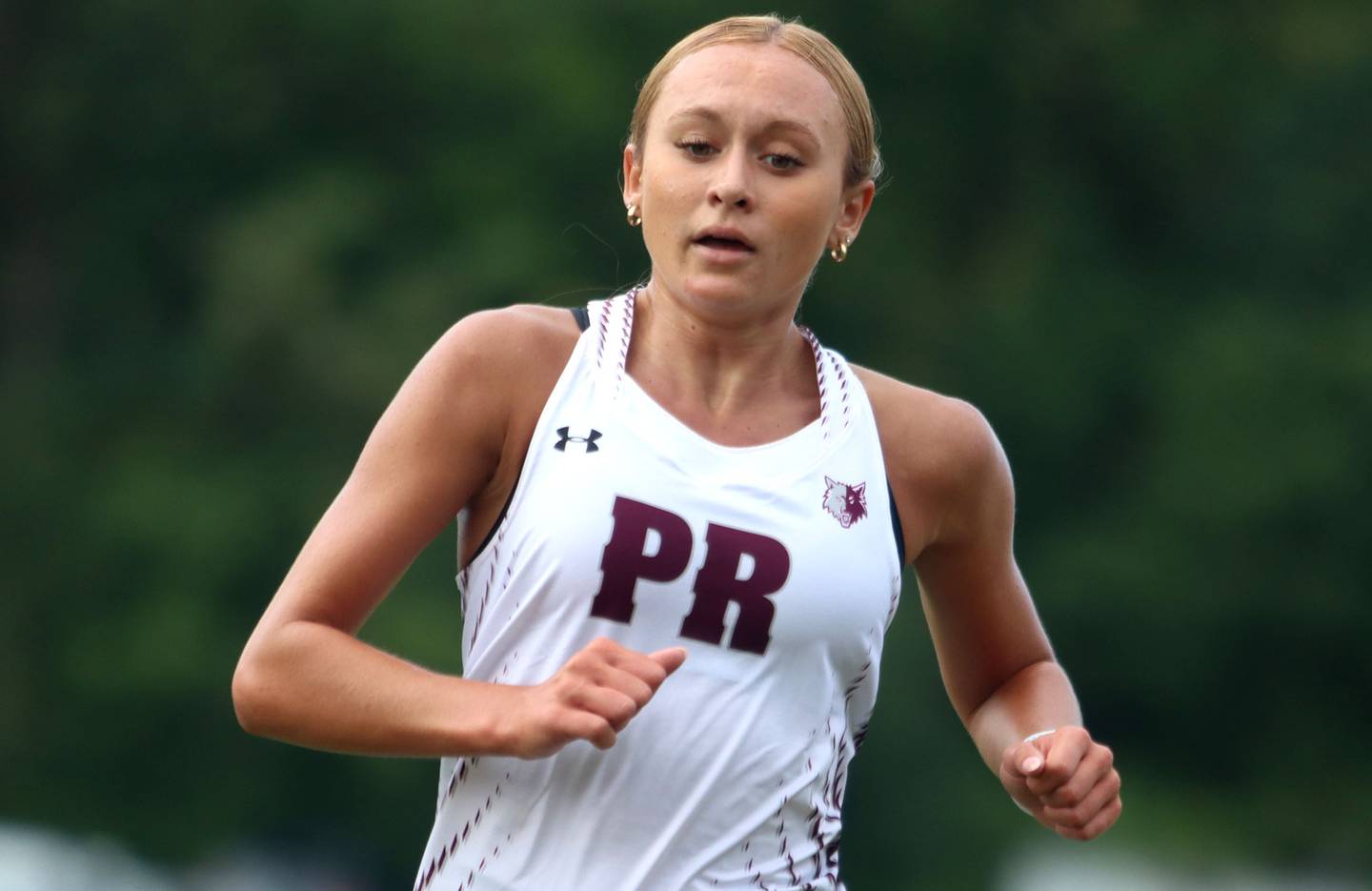 Prairie Ridge’s Anneke Dam completes the girls varsity race of the McHenry County Cross Country Meet at Emricson park in Woodstock on Saturday, August 30, 2025.