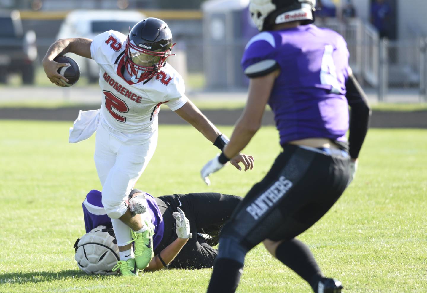Momence's Erick Castillo evades a tackle as he carries the ball in a scrimmage game against Manteno on Friday, August 22, 2025.