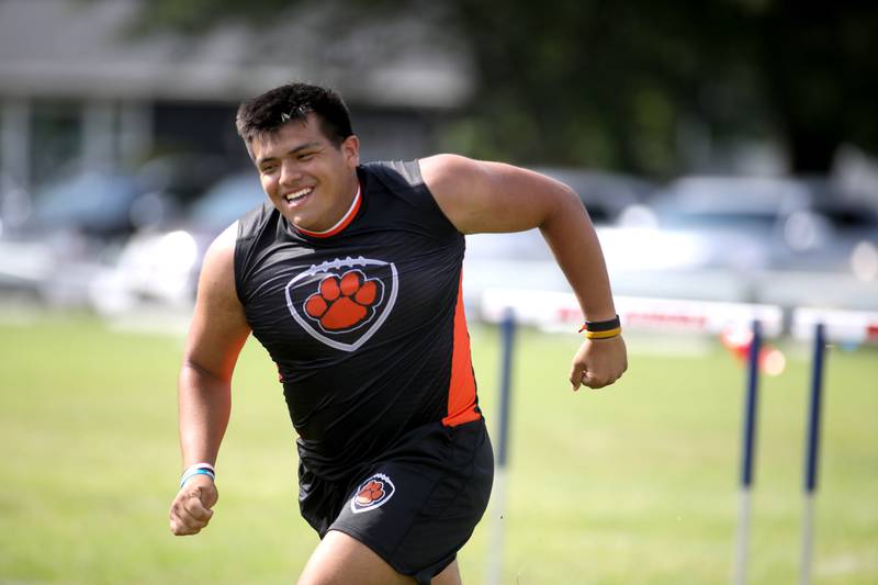 Wheaton Warrenville South’s Aaron Vivar competes in the  annual "Battle of the Big Butts" Linemen Challenge at West Aurora High School on Thursday, July 13, 2023.