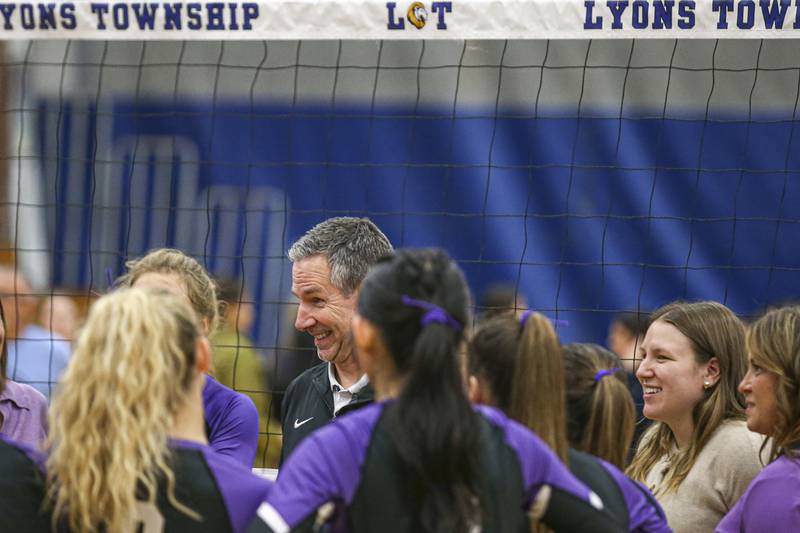 Downers Grove North's head coach Mark Wasik addresses the team after their win over Downers Grove South in their Class 4A Lyons Sectional Semifinal volleyball match. Nov 4, 2025 in La Grange.