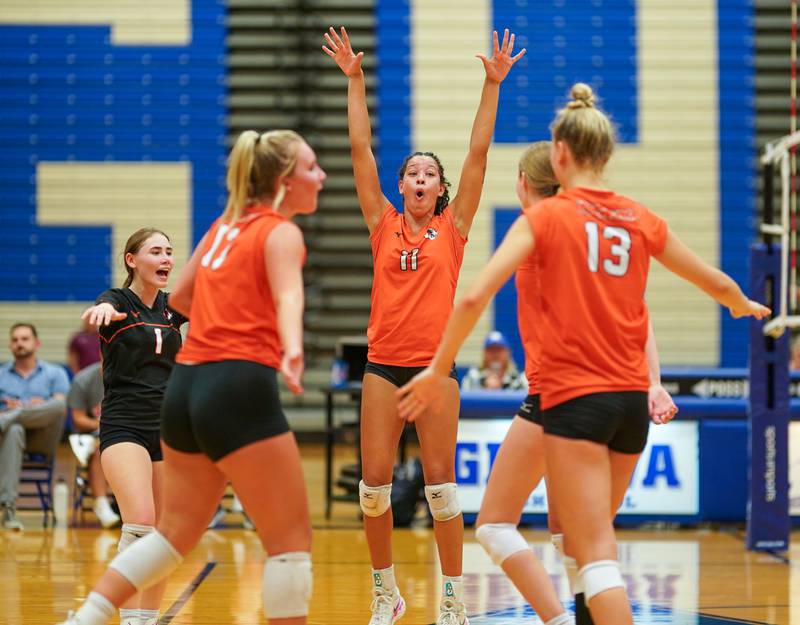Wheaton Warrenville South's Maddison Mlady-Gibson (11) celebrates after scoring on kill attempt against Geneva during a volleyball match at Geneva High School on Tuesday, Sep 5, 2023.