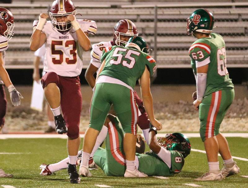Morris's Aiden Swan reacts after sacking L-P quarterback Marion Persich as teammate Gus Konieczki helps him up on Friday, Sept. 20, 2024 at Howard Fellows Stadium.