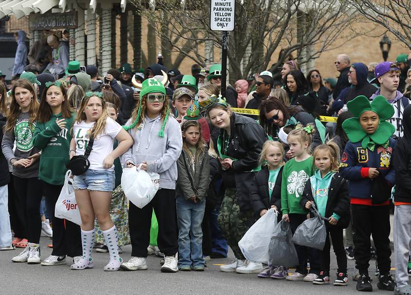 Children wait for the McHenry ShamROCKS the Fox Festival Parade to start on Saturday, March 16, 2024.