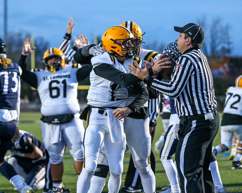 St Laurence's Evan Les (12) celebrates a touchdown run during Class 4A third round playoff football game between St Laurence at IC Catholic Prep.  Nov 11, 2023.