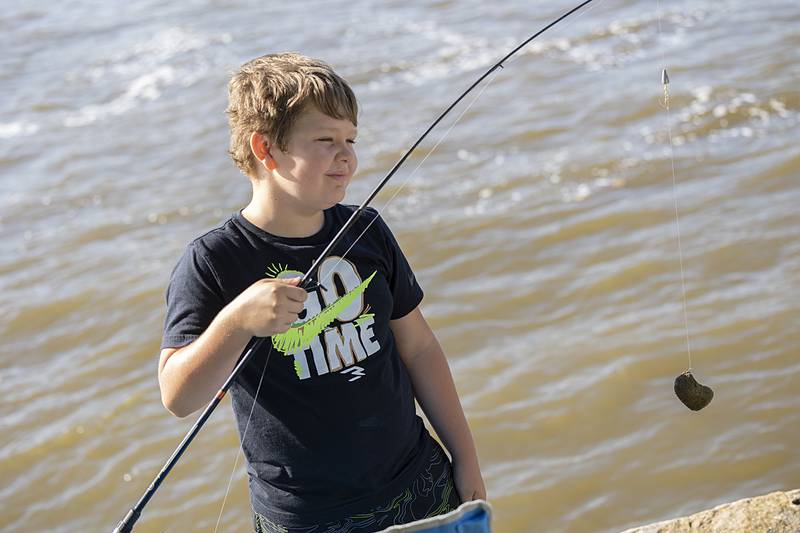 It wasn’t a rock, it was a rock lobster! No unfortunately for Huck Dale, 8, it was a rock that he hooked Saturday, July 6, 2024 during the Petunia Fest fishing derby.