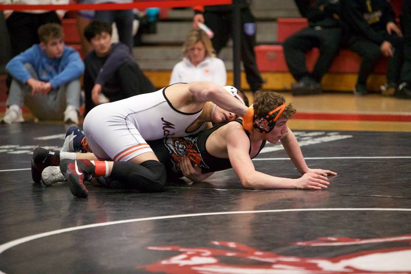 McHenry's Chris Moore comets against Libertyville's Matt Kubas  in the 170 lb Championship match at the Class 3A Sectional at Barrington High School on Saturday, Feb. 11, 2023.