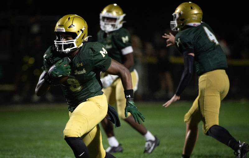 Bishop McNamara's Julius May carries the ball on a play in a game against Chicago Christian on Friday, September 19, 2025.