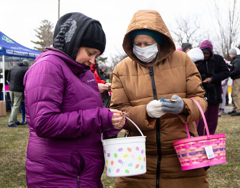 Ann McCord, left, and Gloria Frillman check their raffle tickets during the Elmhurst Park District's Adult Easter Egg Hunt at Wilder Park on Saturday, March 18, 2023.