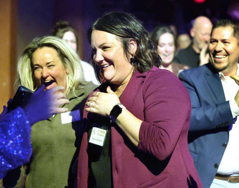 Devyn Grzywa reacts after hearing her name announced as this years recipient of the Athena Award Thursday, Oct. 16, 2025, during the 35th annual Athena and Women of Accomplishment Award Reception at the Egyptian Theatre in DeKalb.