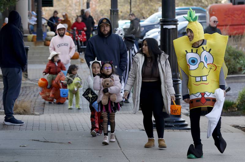 Trick or treaters make their way around the Woodstock Square during Halloween on the Square on Thursday, Oct. 31, 2024, in Woodstock.