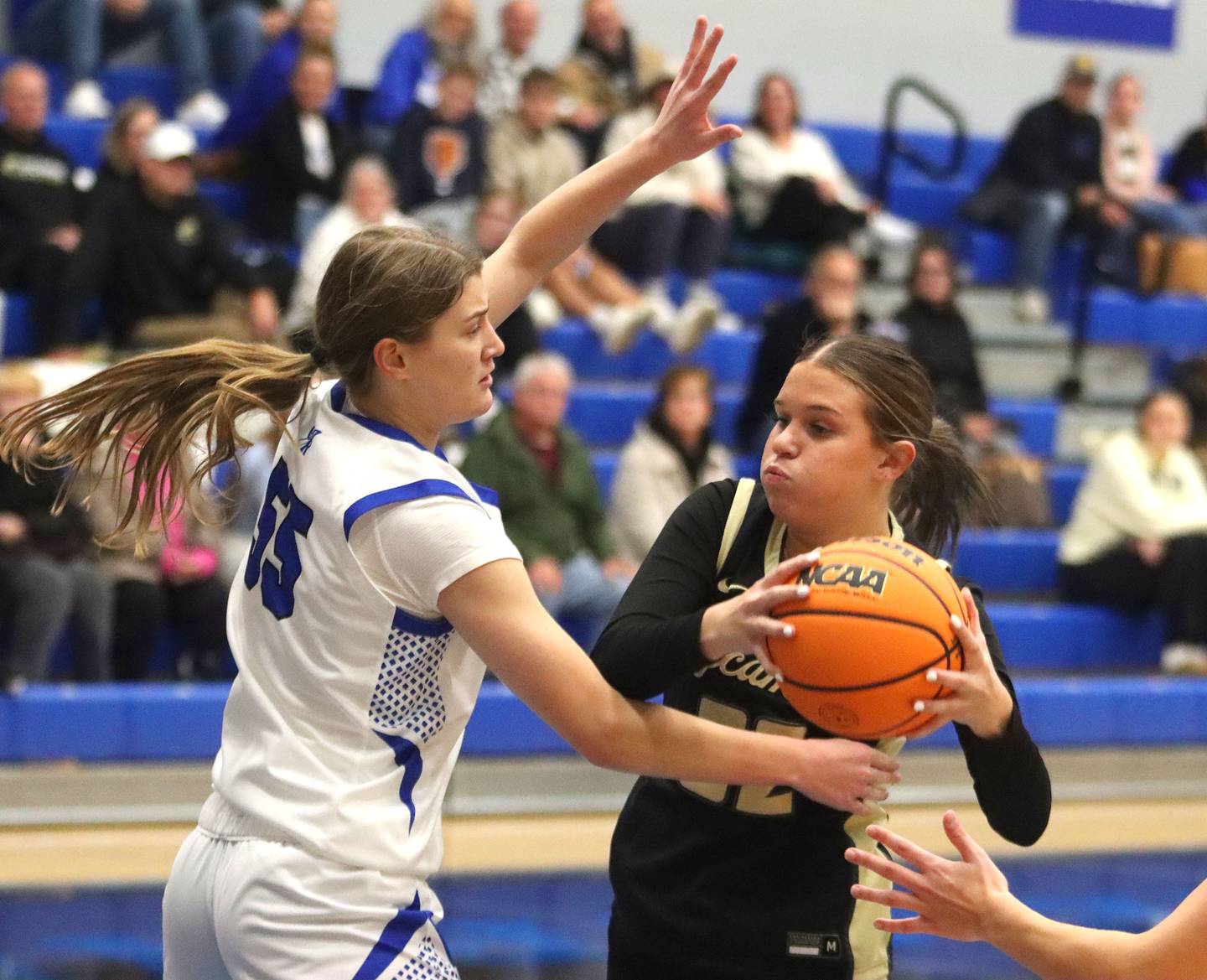 Burlington Central’s Scarlett Lafleur, left, guards  Sycamore’s Quinn Carrier in girls basketball at Burlington Central High School in Burlington on Tuesday, November 18, 2025.
