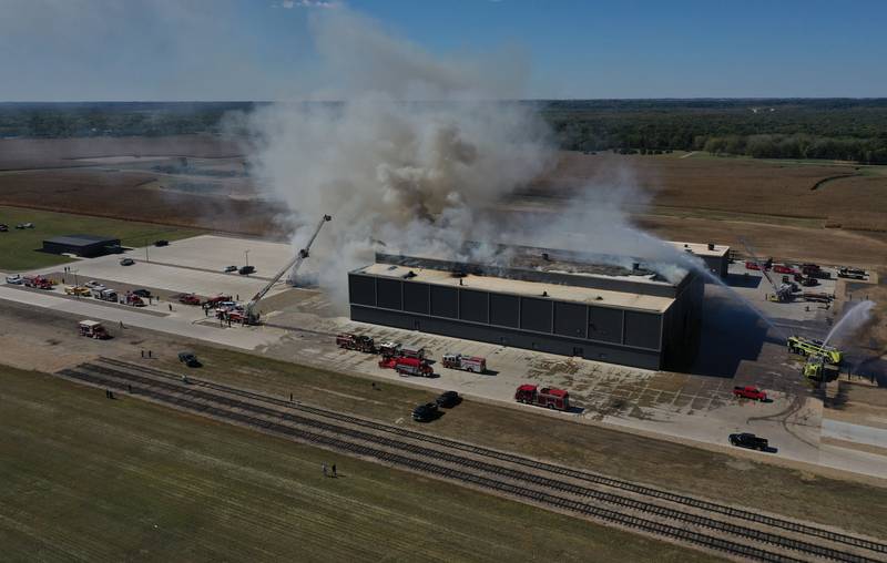 Smoke billows from Marquis Energy as firefighters work to control a structure fire on Wednesday, Oct. 8, 2025 in Hennepin. The fire was upgraded to a 5th alarm dispatching the (MABAS) Mutual Aid Box Alarm System. The fire broke out around 11a.m.