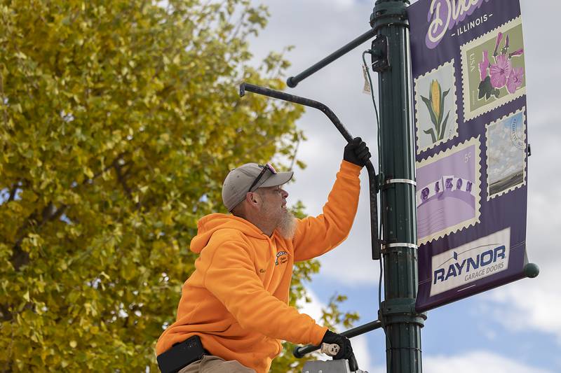 Clayton Beach gets a plug in order for tree lights at the Dixon riverfront Wednesday, Nov. 20, 2024.