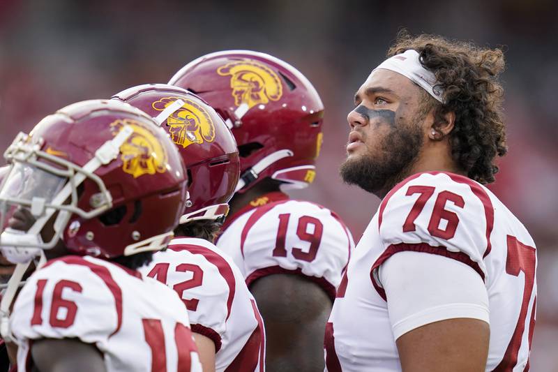 Southern California offensive lineman Mason Murphy (76) and teammates look up to the scoreboard during the first half of an NCAA college football game against Stanford in Stanford, Calif., Saturday, Sept. 10, 2022. (AP Photo/Godofredo A. Vásquez)