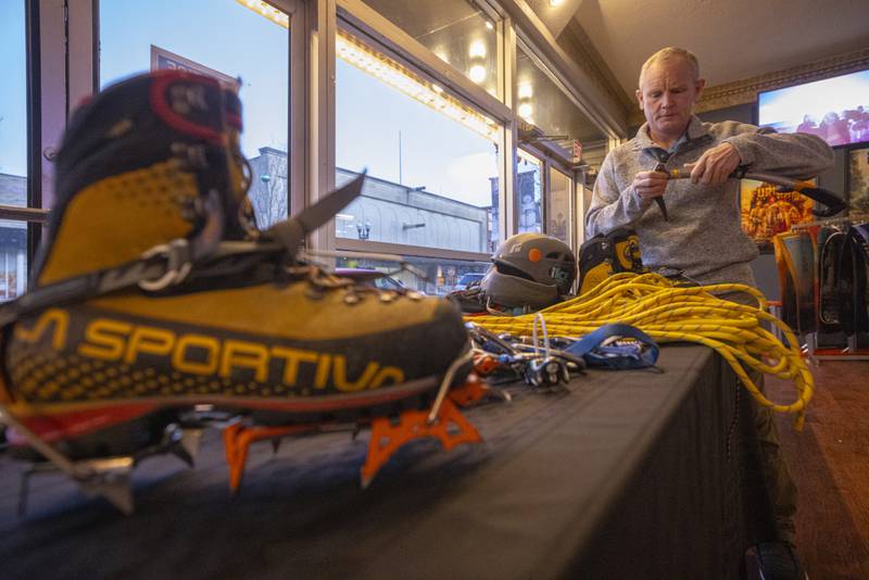 Wes Black, one of the ice climbers filmed in the documentary, sets up his gear on the display table in the lobby. The booth allowed movie attendees to get up close with the equipment that allows the frozen waterfalls to be ascended.