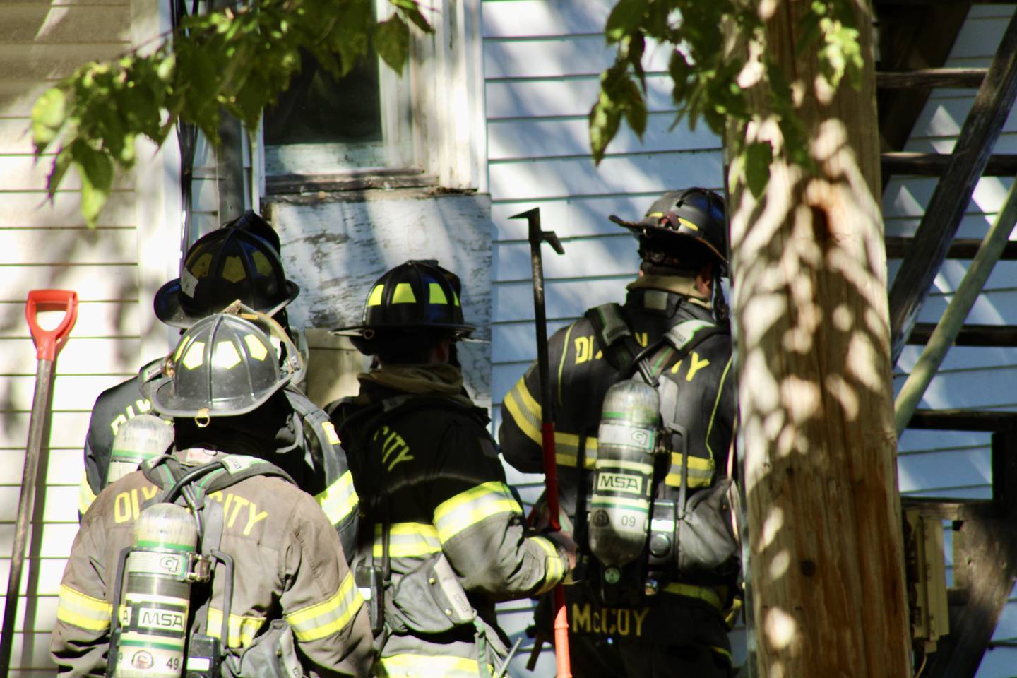 A squad of four Dixon City firefighters begins to ascend stairs to enter the second-story apartment entrance at 410 Madison Ave. on Thursday afternoon. Everyone safely escaped the building and no one was hurt in the structure fire, which was started in the bathroom, the fire department said. There is water damage throughout the apartment building. Firefighters were still on the scene for about two hours.