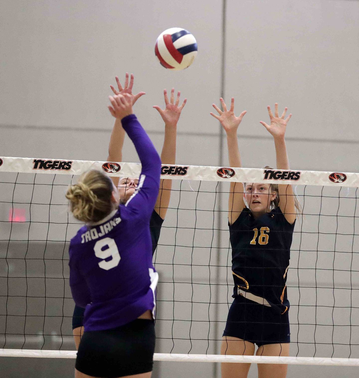 Brian Hill/bhill@dailyherald.com
Downers Grove North’s Kelley Crowley (9) hits the ball past Neuqua Valley’s Anja Kelly (11) and Eleanor O’Neal Saturday September 17, 2022 in Wheaton.
