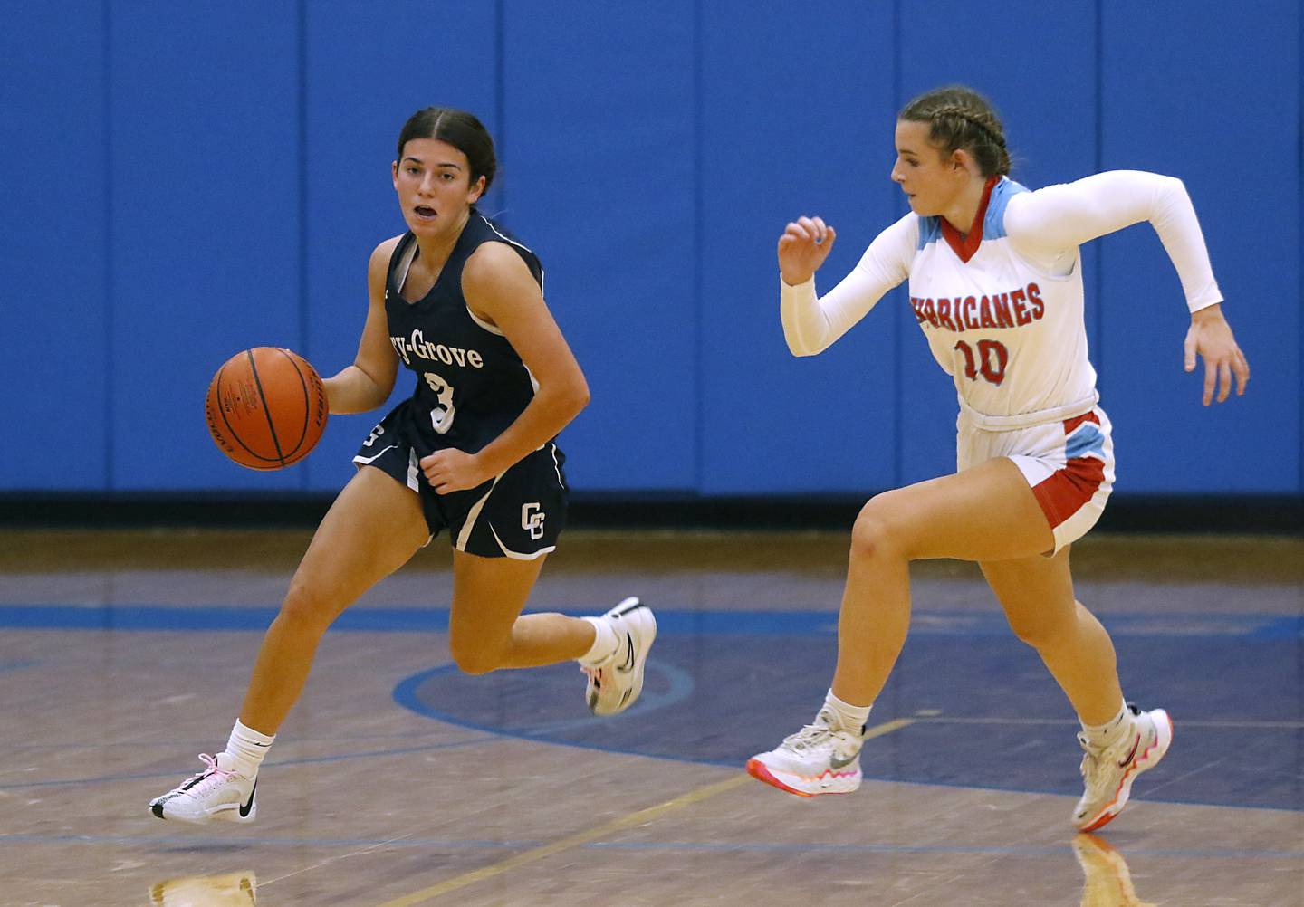 Cary-Grove's Sam Skerl pushes the ball up the court against Marian Central's Adriana Wrzos on Thursday, Nov. 16, 2023, during a Johnsburg Thanksgiving Tournament girls basketball game at Johnsburg High School.