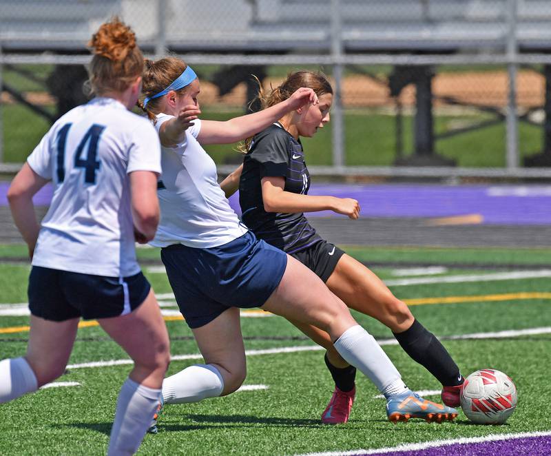 Downers Grove North’s Jordyn Sashin (right) kicks her second goal of the game against Downers Grove South on May 10, 2025 at Downers Grove North High School in Downers Grove .
