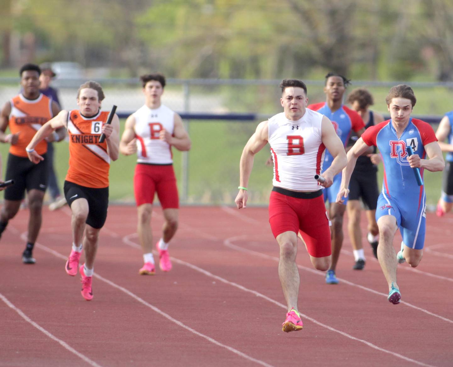 Batavia’s Joe Reid runs the anchor leg of the 4 x 100-meter relay during the Kane County Championships track and field meet at St. Charles North on Friday, May 5, 2023.