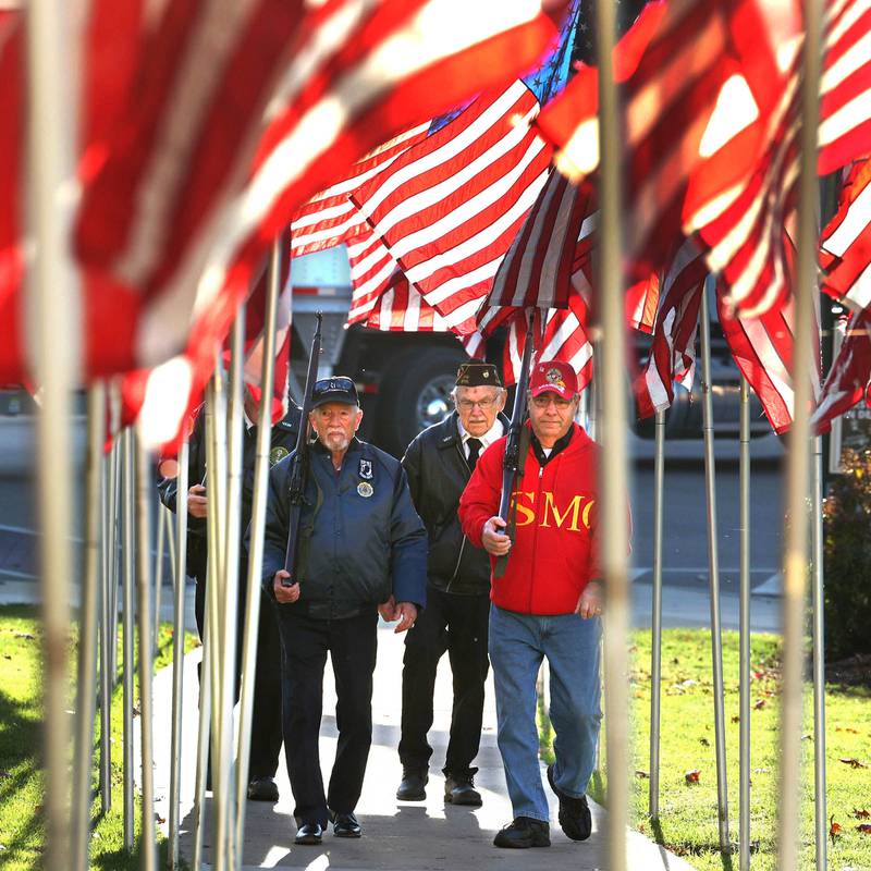 US Army Veterans Ron Lanni, (left) Stan Eden and US Marine Corp Veteran Paul Brescia (right) along with US Army veteran John Tuttle (not pictured) take their guard shift Friday, Nov. 8, 2024, during the opening of the 24-Hour Veterans Vigil at the DeKalb County Courthouse in Sycamore.