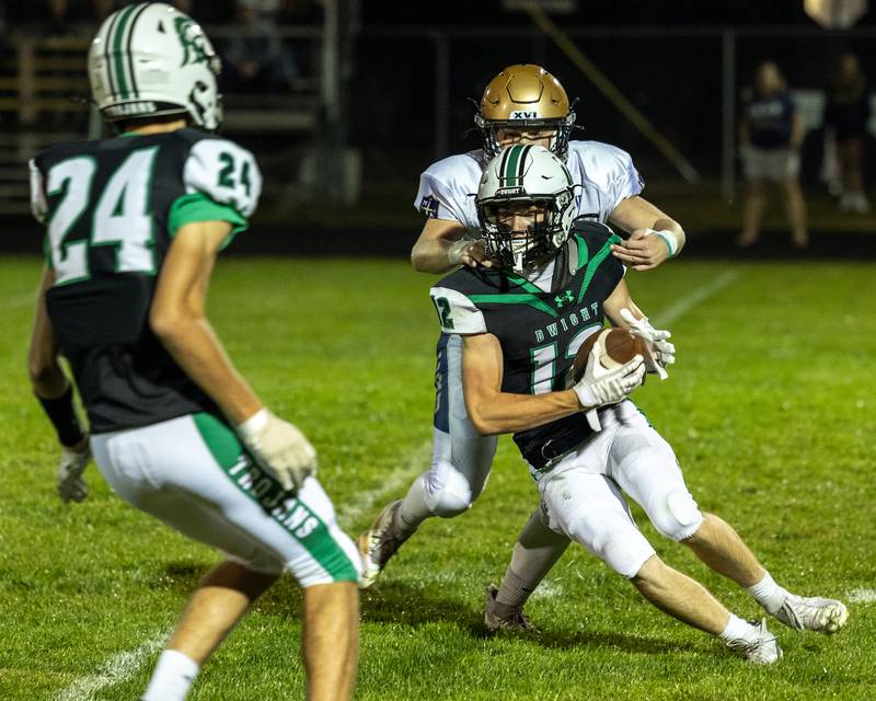 Asher Kargle (12) of Dwight is chased by Ben Walker (13) of Marquette on Friday, Sept. 19, 2025 at Dwight High School in Dwight.