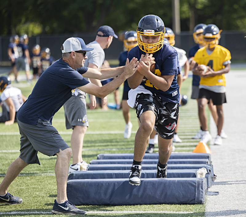 Sterling players run through drills during first day of football practice Monday, August 7, 2023.