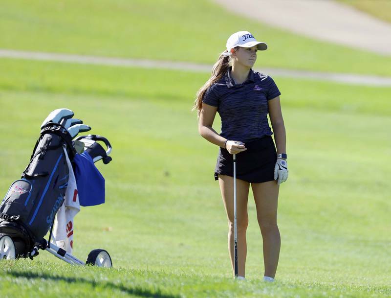 Delaney Spontak of Glenbard South, reacts to her chip during the IHSA Class 2A West Chicago girls golf regional at St. Andrews Tuesday, Oct. 1, 2024 in West Chicago.