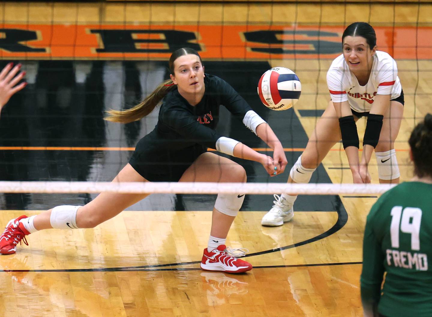 Huntley's Alexandria Goritz receives a Fremd serve Monday, Nov. 11, 2024, during their Class 4A supersectional match against Fremd at DeKalb High School.