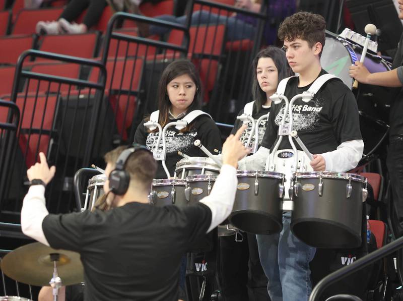 Members of the Rock Falls band keep fans entertained during a lull in the action at the IHSA girls state basketball playoffs Friday, March 4, 2022, in Redbird Arena at Illinois State University in Normal.