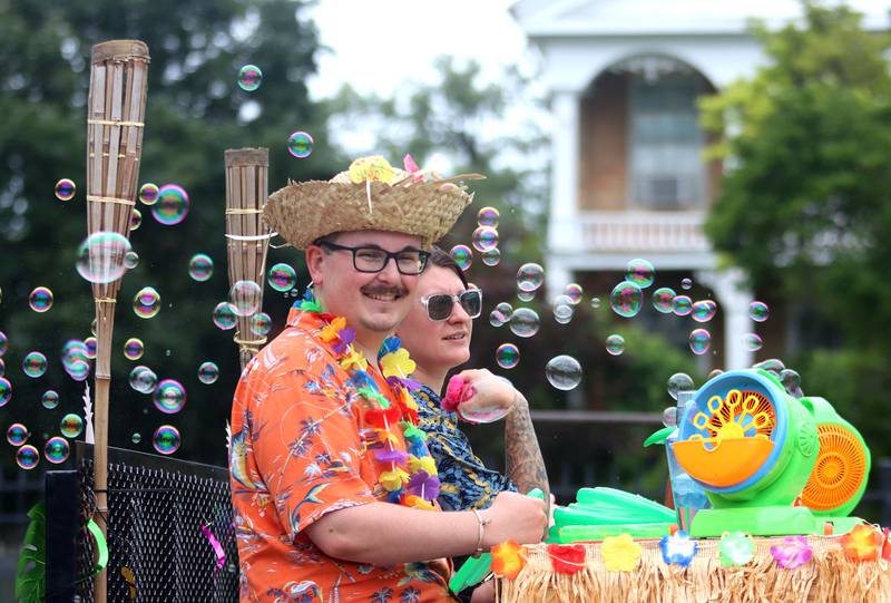 The group from Above Par Construction participates in the Fiesta Days Parade on Main Street in McHenry on Sunday, July 20, 2025.