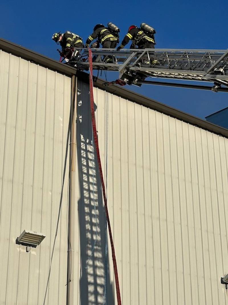 Firefighters respond to a fire at a manufacturing plant in Lake in the Hills Monday, Oct. 16, 2023.