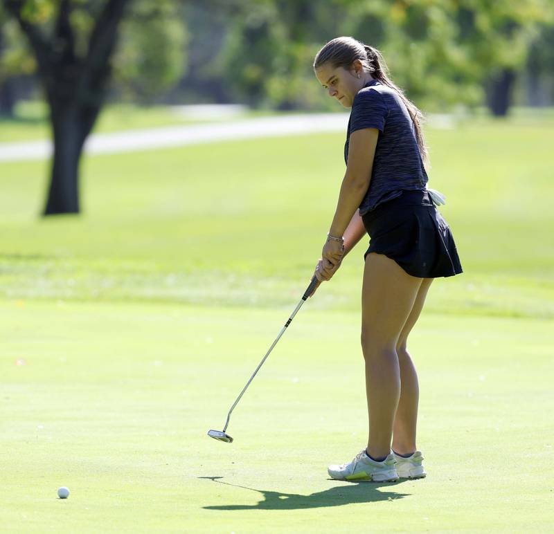 Kate Bruhl of Glenbard South, watches her putt during the IHSA Class 2A West Chicago girls golf regional at St. Andrews Tuesday, Oct. 1, 2024 in West Chicago.