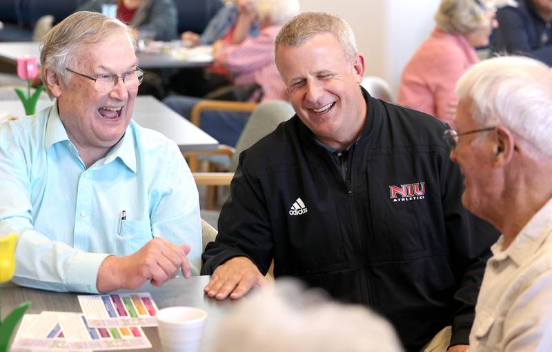 Former DeKalb Mayor Jerry Smith (left) and current Mayor Cohen Barnes (center) have a laugh with an attendee Monday, April 10, 2023, at the Family Service Agency’s Club 55 in DeKalb. The club was celebrating its grand reopening in its new location at Bethlehem Lutheran Church, 1915 North First Street in DeKalb.