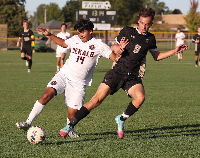 DeKalb's Martin Valenzuela tries to hold off Sycamore's Felix Arends during the El Classicorn rivalry game Tuesday, Oct. 7, 2025, at Sycamore High School.