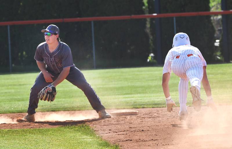Dixon's Jake Zepezauer waits for a throw from his catcher as Byron's Weston Auker begins to slide to steal second during a Big Northern Conference game in Byron on Monday, May 11, 2026.