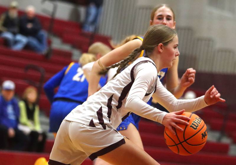 Marengo’s Sophie Hanson moves the ball against Johnsburg in varsity girls basketball on Tuesday, Jan. 6, 2026 at Homer “Bill” Barry Gymnasium on the campus of Marengo High School in Marengo.