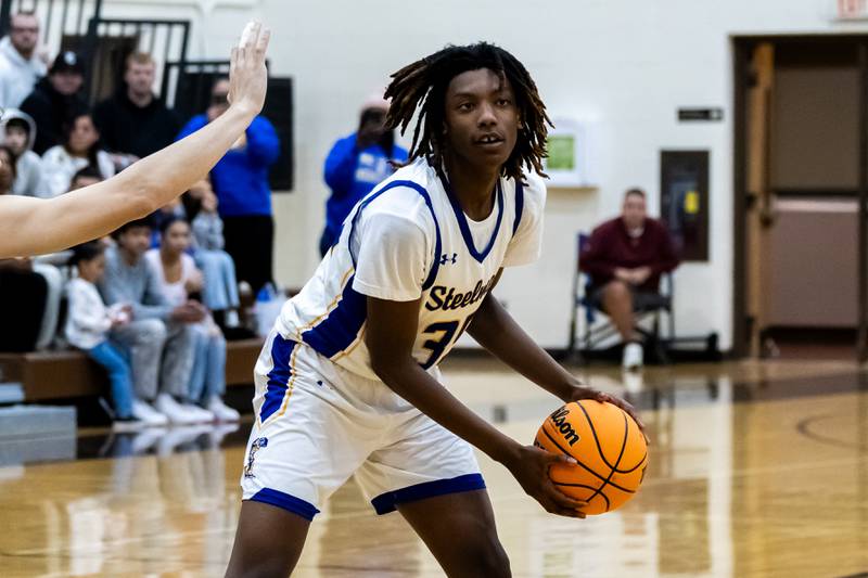 Joliet Central's Revell Gilbert looks for an open teammate during a WJOL Thanksgiving Classic Boys Basketball game against Lockport at the University of St. Francis’s Pat Sullivan Center in Joliet on Nov. 24, 2025.