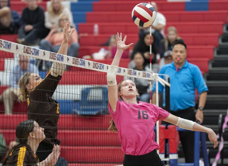 Dundee-Crown's Victoria Brents, right, battles at the net with Jacobs' Rachelle Zieba and Hailie Barton during their game on Thursday, October 16, 2025 at Dundee-Crown High School in Carpentersville. Ryan Rayburn for Shaw Local