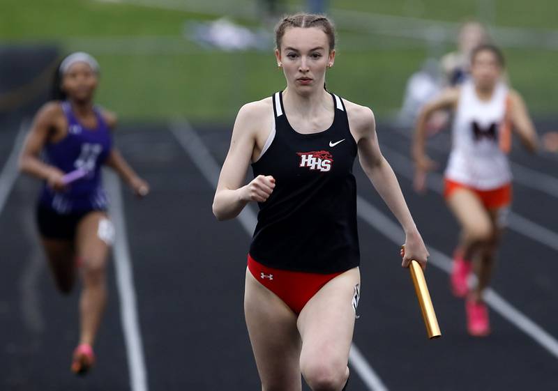 Huntley’s Addison Busam lruns to the finish line as she races the final leg of the 4 x 200 meter relay on Thursday, May 2, 2024, during the Fox Valley Conference Girls Track and Field Meet at Jacobs High School in Algonquin.
