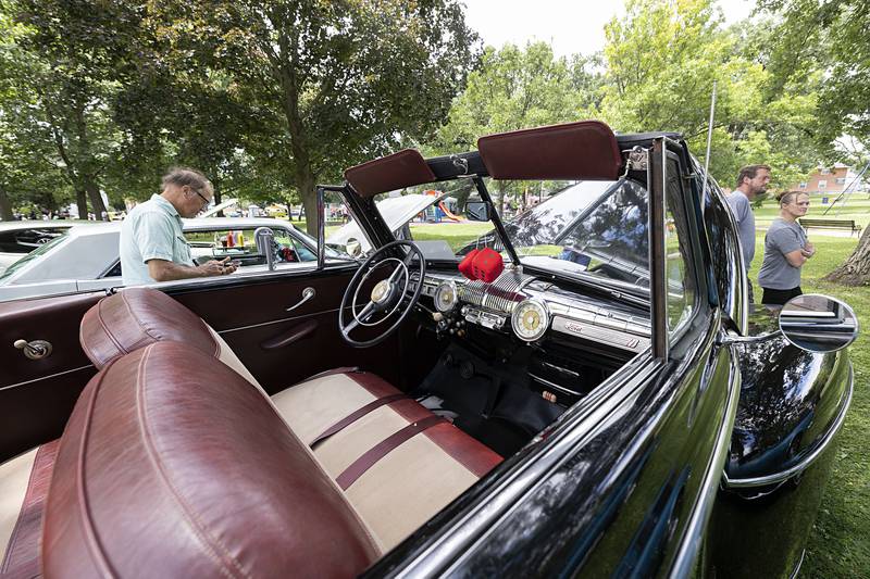 Steve and Betty Snitchler’s ’48 Ford sits on display Friday, July 5, 2024 at the Petunia Fest car show. The convertible feature is what sold the couple on the car.