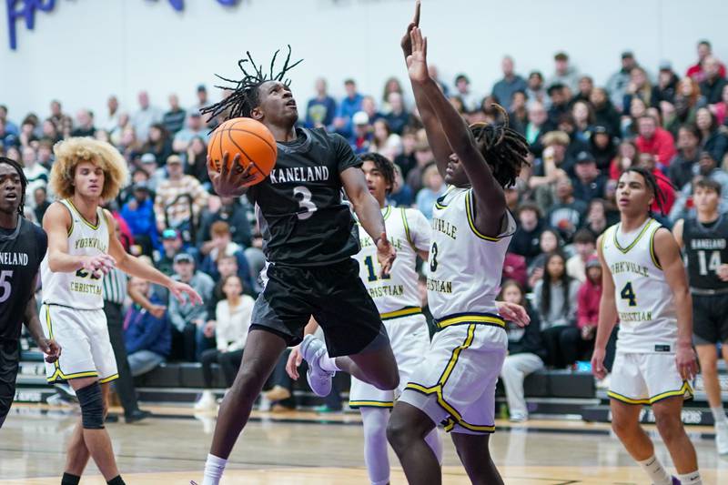Kaneland's Marshawn Cocroft shoots the ball in the post against Yorkville Christian's Jayden Riley during a championship final basketball game in the 61st annual Plano Christmas Classic at Plano High School on Saturday, December 28, 2024.