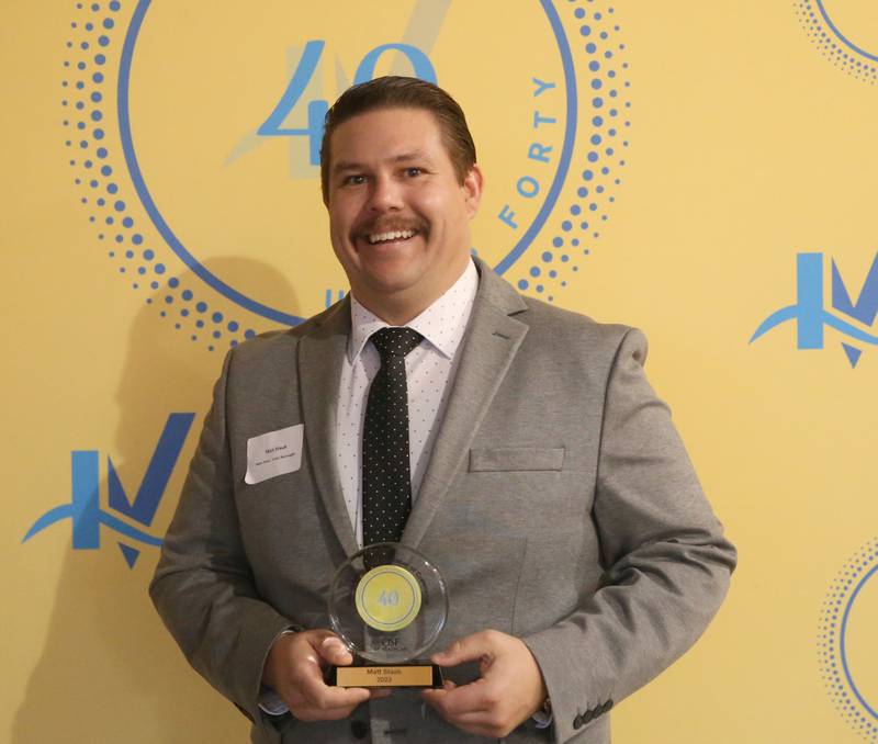 Matt Stabb poses for a photo with his award during the 40 Under Forty awards banquet on Thursday, March 21, 2024 at Westclox in Peru.