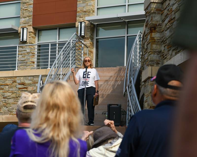 Participants listen as Cindy Hupke talks on Sunday Sept. 21, 2025, before the start of the Be the One Walk held at the Kishwaukee Health & Wellness Center in Sycamore.