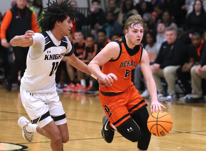 DeKalb's Sean Reynolds pushes the ball ahead of Kaneland's Evan Frieders during their game Tuesday, Jan. 28, 2025, at Kaneland High School in Maple Park.