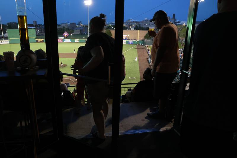 Fans enjoy the Joliet Slammers’ home opener from a suite against the Ottawa Titans. Friday, May 13, 2022, in Joliet.