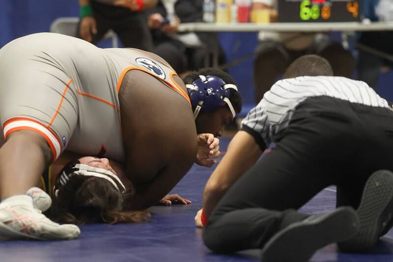 Romeoville’s Jamir Thomas looks to pin Joliet West’s Carlos Quiroz in a dual meet on Thursday, Dec.14th, 2023 in Romeoville.