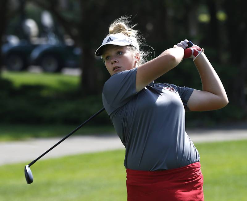 Huntley’s Maddie Sloan watchers her tees shot on the first hole during the Fox Valley Conference Girls Golf Tournament Wednesday, Sept. 21, 2022, at Crystal Woods Golf Club in Woodstock.