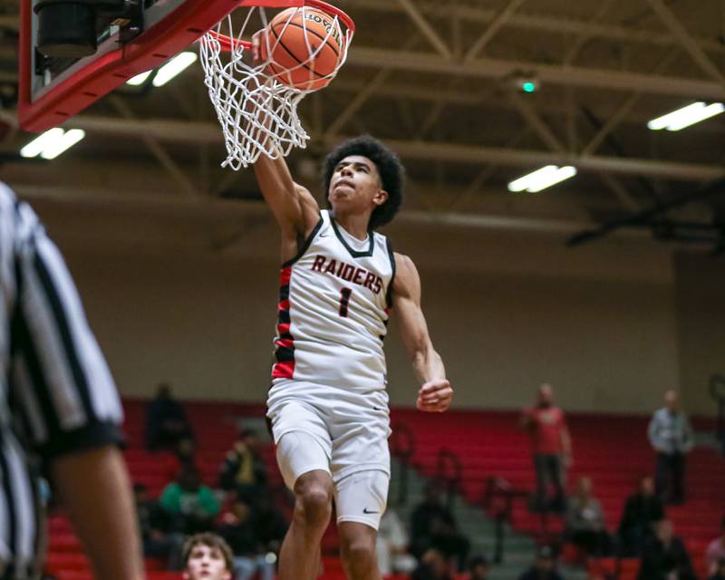 Bolingbrook's Braden Pettigrew (1) dunks after the whistle during their basketball game between Plainfield North at Bolingbrook, Friday Dec 13, 2024 in Bolingbrook.